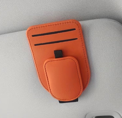 Orange car sun visor eyeglass holder