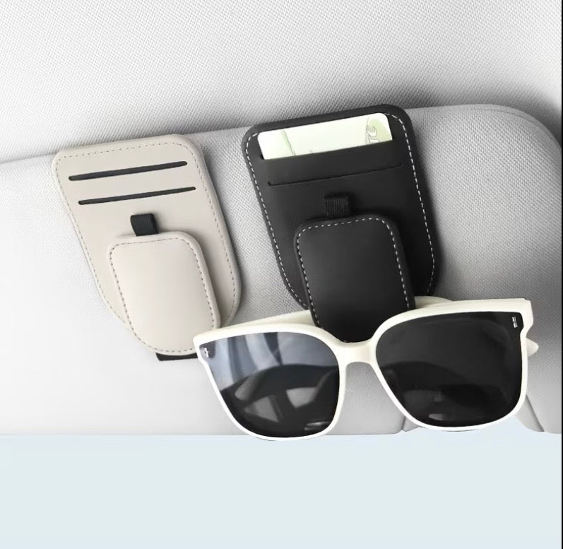Black white and orange car eyeglass holders