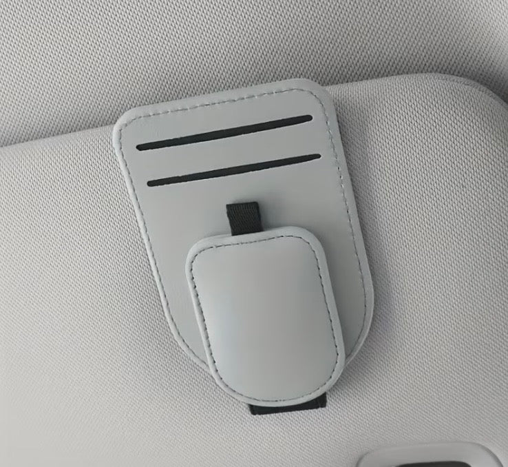 White car sun visor eyeglass holder