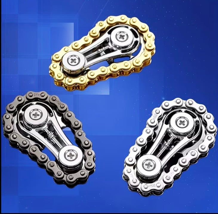 Three chain fidget toys in gold, black and silver